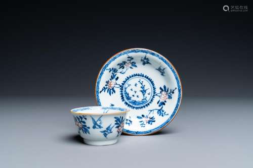 A CHINESE BLUE, WHITE AND COPPER-RED CUP AND SAUCER, KANGXI