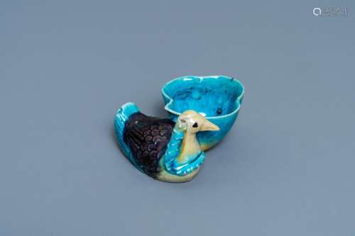 A CHINESE AUBERGINE- AND TURQUOISE-GLAZED DUCK AND LOTUS-SHA...