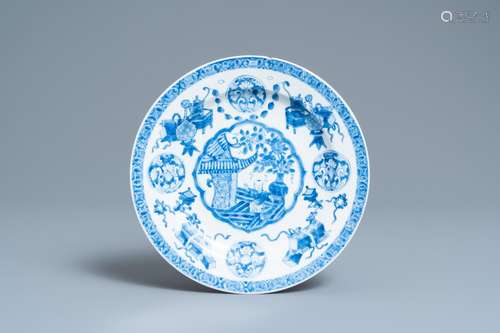 A CHINESE BLUE AND WHITE PLATE WITH A BOY SURROUNDED BY ANTI...