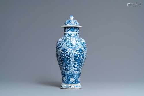 A CHINESE BLUE AND WHITE VASE AND COVER WITH FLORAL DESIGN, ...