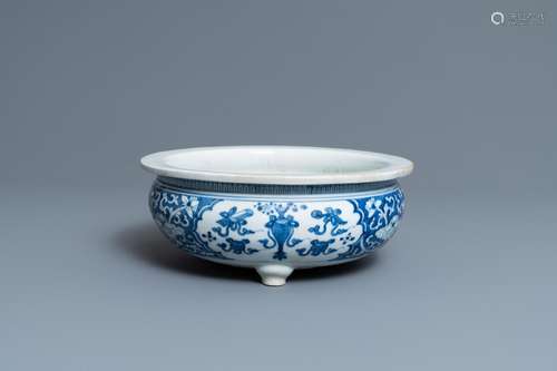 A CHINESE BLUE AND WHITE TRIPOD CENSER WITH ANTIQUITIES, KAN...