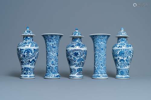 A CHINESE BLUE AND WHITE FIVE-PIECE GARNITURE WITH FLORAL DE...