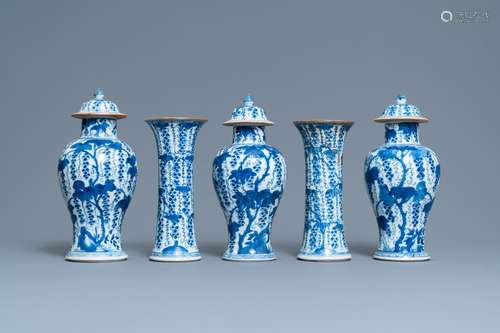 A CHINESE BLUE AND WHITE FIVE-PIECE GARNITURE WITH GRAPEVINE...