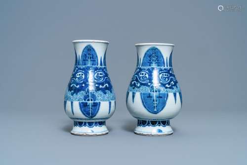 A PAIR OF CHINESE BLUE AND WHITE 'TAOTIE' VASES, K...