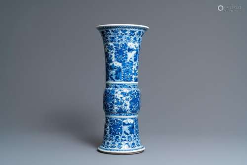 A CHINESE BLUE AND WHITE 'GU' VASE WITH FLORAL AND...