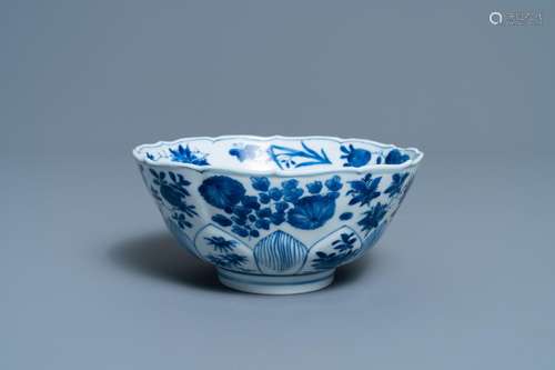 A CHINESE BLUE AND WHITE LOTUS-MOLDED BOWL WITH FLORAL DESIG...