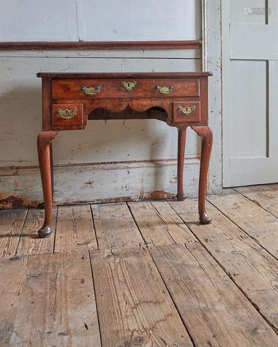 A GEORGE I WALNUT AND CROSSBANDED SIDE TABLE, CIRCA 1725