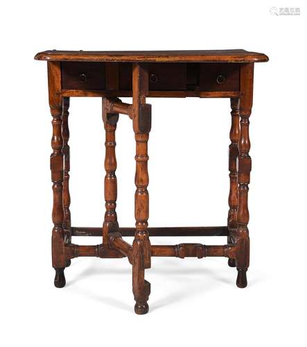 A GEORGE I WALNUT FOLDING WRITING TABLE, CIRCA 1720