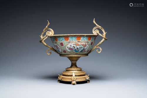 Lot 714: A CHINESE GILT BRONZE-MOUNTED FAMILLE ROSE BOWL, 19...