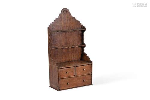 A GEORGE II OAK SPOON RACK, CIRCA 1750