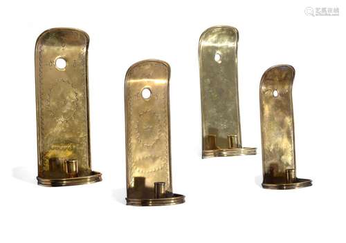 A SET OF FOUR EMBOSSED SHEET BRASS WALL SCONCES, 18TH CENTUR...