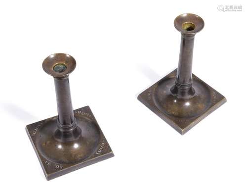 AN UNUSUAL PAIR OF BRASS TABLE CANDLESTICKS FROM LLOYD'...