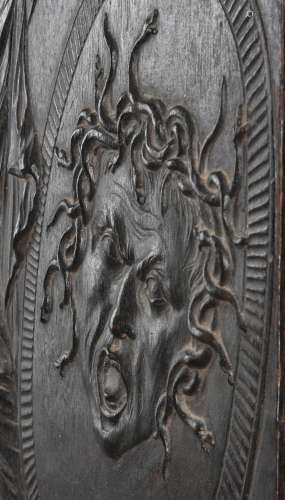 A GEORGE II RELIEF CARVED EBONISED MAHOGANY CHIMNEY BOARD, M...