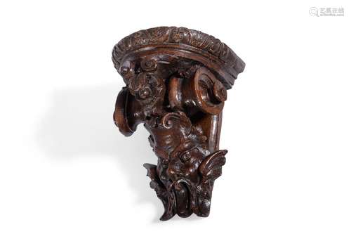 A GEORGE II CARVED OAK WALL BRACKET, CIRCA 1730