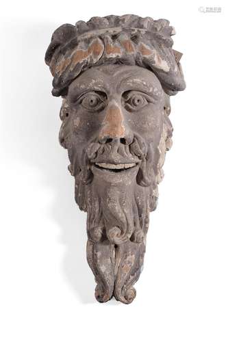 A GEORGE II CARVED SOFTWOOD AND PAINTED MASK WALL MOUNT PROB...