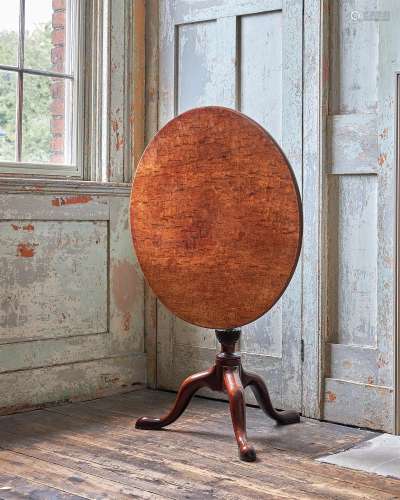 AN EARLY GEORGE III FUSTIC AND MAHOGANY TRIPOD TABLE, IN THE...