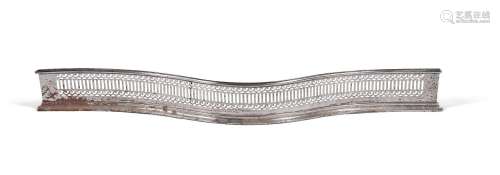 A GEORGE III POLISHED STEEL SERPENTINE FIRE FENDER, LATE 18T...