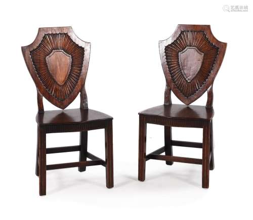 A PAIR OF GEORGE III MAHOGANY HALL CHAIRS, CIRCA 1780