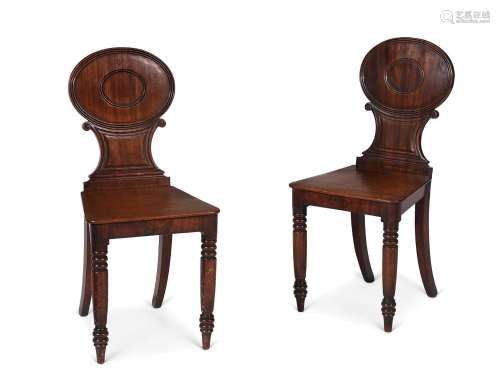 A PAIR OF GEORGE IV MAHOGANY HALL CHAIRS, IN THE MANNER OF G...