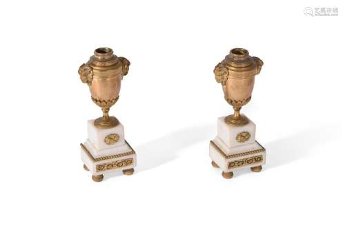 A PAIR OF GEORGE IV GILT BRONZE AND CARRARA MARBLE CASSOLETT...