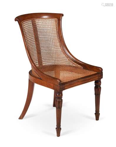 A REGENCY BEECH 'CURRICLE' LIBRARY ARMCHAIR, ATTRI...