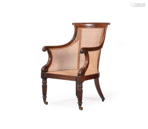 A REGENCY MAHOGANY BERGERE LIBRARY ARMCHAIR, CIRCA 1825