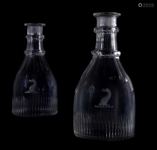 A PAIR OF REGENCY CRESTED GLASS SERVING BOTTLES, CIRCA 1820