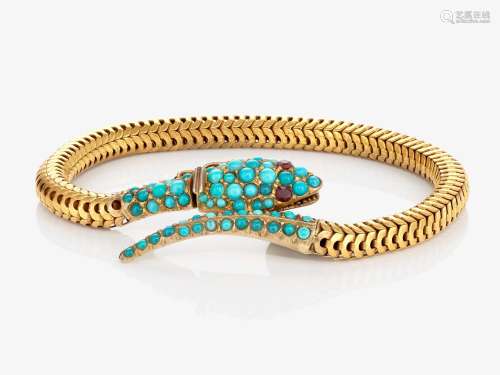 A bracelet in the shape of a snake with turquoise and garnet...
