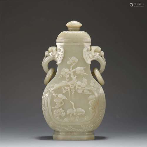 A Carved White Jade Vase With Double Handels