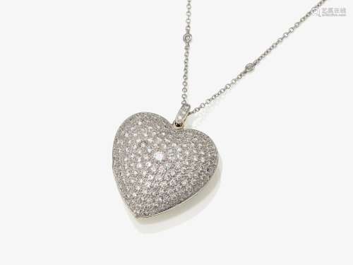 A heart-shaped locket with brilliant cut diamonds and rock c...