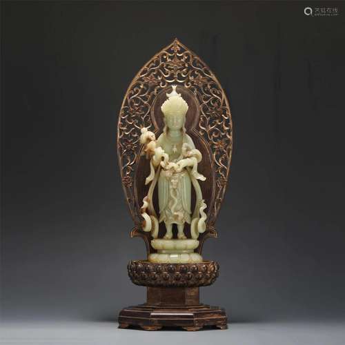 A Carved Yellow Jade Guanyin With Wooden Stand