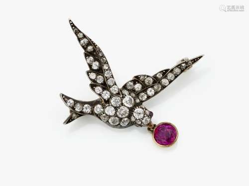 A historical bird brooch decorated with diamonds and a Burme...