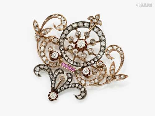 A brooch with diamonds and rubies