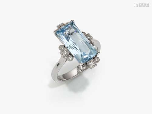 A cocktail ring decorated with aquamarine and brilliant cut ...