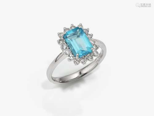 An entourage ring decorated with apatite and brilliant cut d...