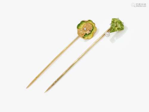 Two tie pins with woman's head and peridot