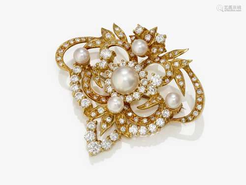 A brooch with brilliant cut diamonds and cultured pearls