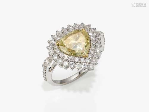 A ring with a yellow brilliant cut diamond and diamonds