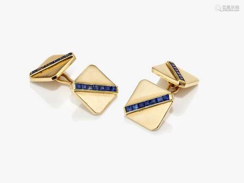 A pair of cufflinks with sapphires and brilliant cut diamond...