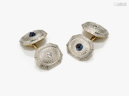 A pair of cufflinks with sapphires and brilliant cut diamond...