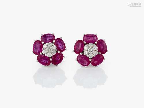 Stylized floral stud earrings decorated with rubies and bril...