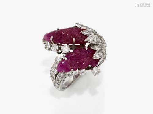A floral stylized cocktail ring studded with rubies and diam...