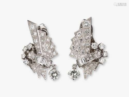 A pair of ear clips with brilliant cut diamonds