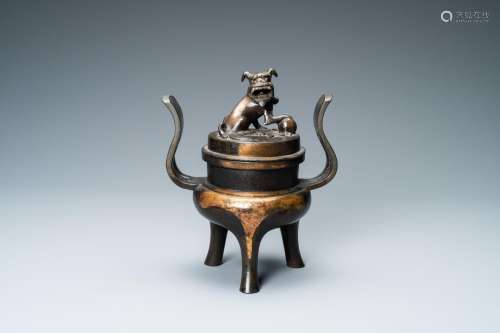 Lot 845: A CHINESE PARTLY GILDED BRONZE TRIPOD CENSER AND CO...
