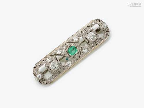 A brooch with emerald and diamonds