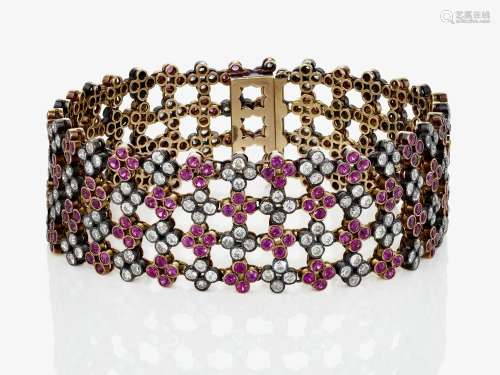 A historical link bracelet decorated with rubies and diamond...