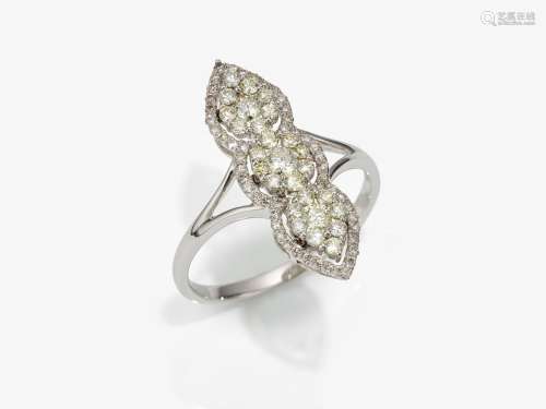 A marquise ring decorated with brilliant cut diamonds