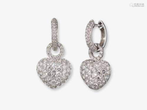 Diamond-studded creole earrings with heart pendants