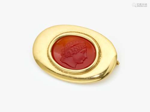A brooch with a carnelian engraved gem