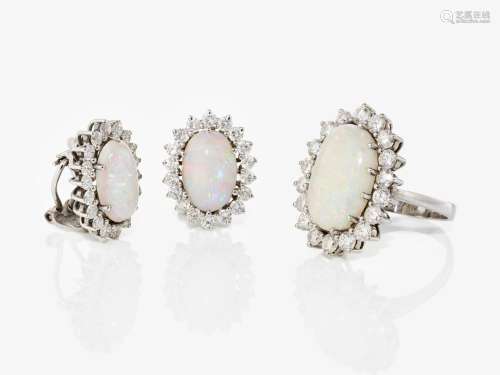 A pair of ear clips and a ring with crystal opals and brilli...